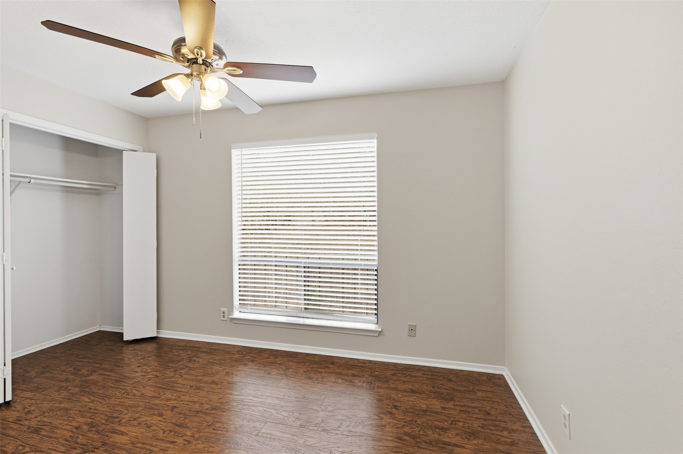 8142 Ceberry Drive, Unit B Austin, TX 78759 - Photo 23 of 38 an empty room with windows and fan