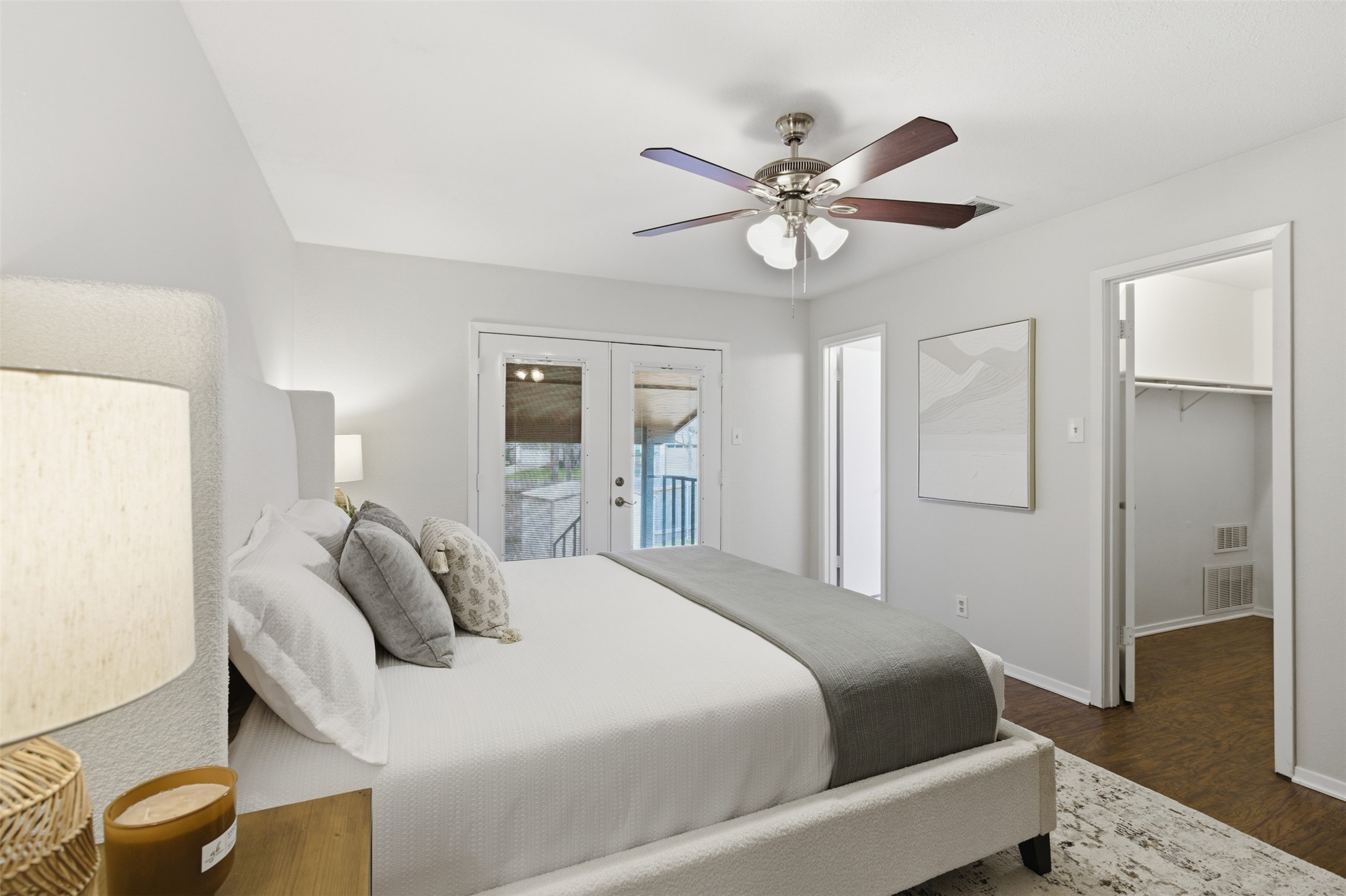 8142 Ceberry Drive, Unit B Austin, TX 78759 - Photo 28 of 38 a bedroom with a bed and a chandelier