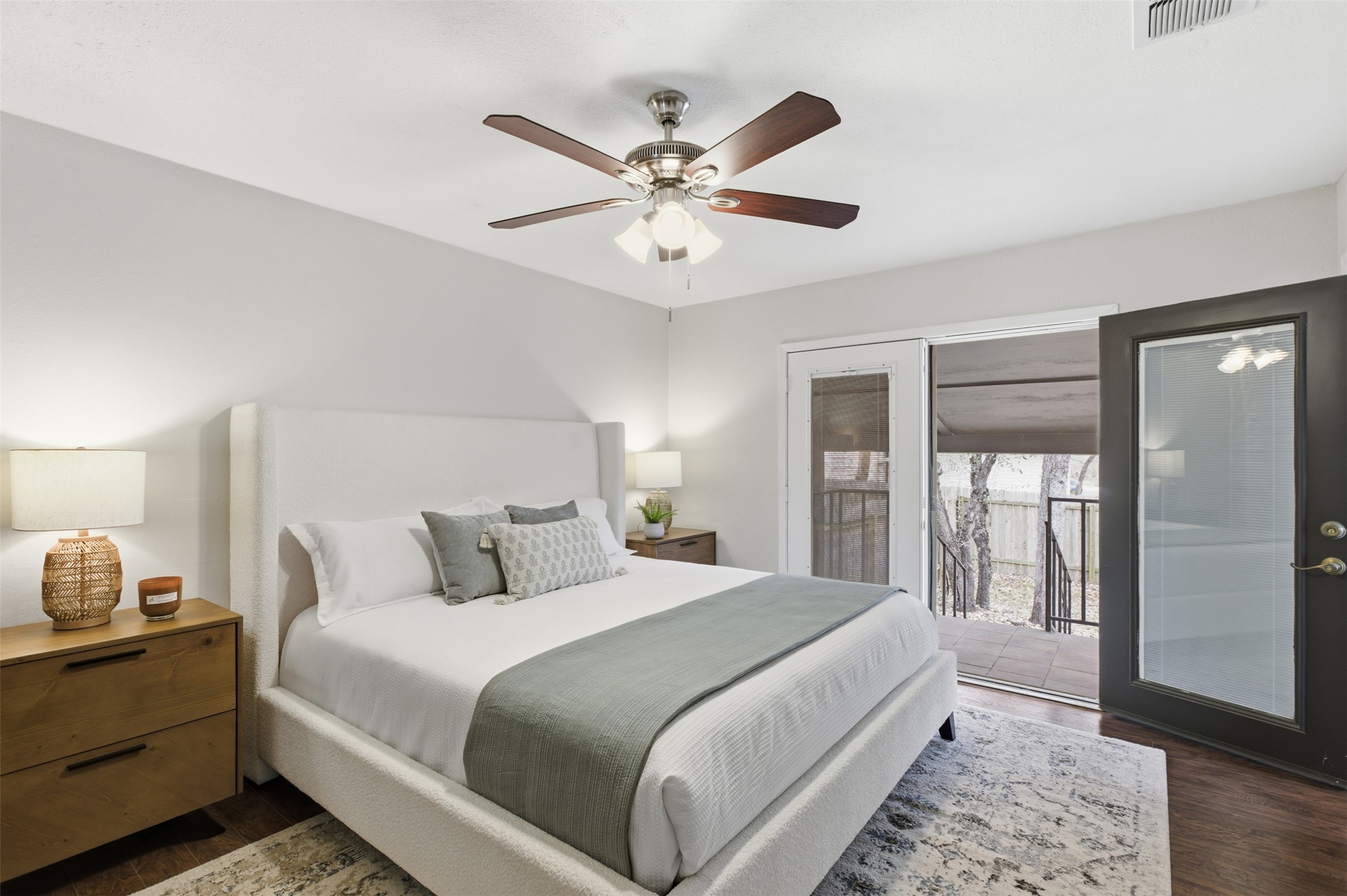 8142 Ceberry Drive, Unit B Austin, TX 78759 - Photo 29 of 38 a bedroom with a large bed and a chandelier