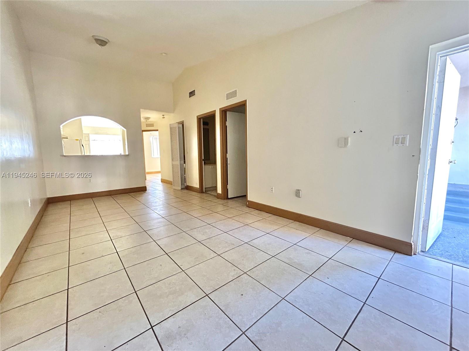 1250 Southeast 29th Street, Unit 20258 Homestead, FL 33035 - Photo 2 of 13 a view of an empty room and window
