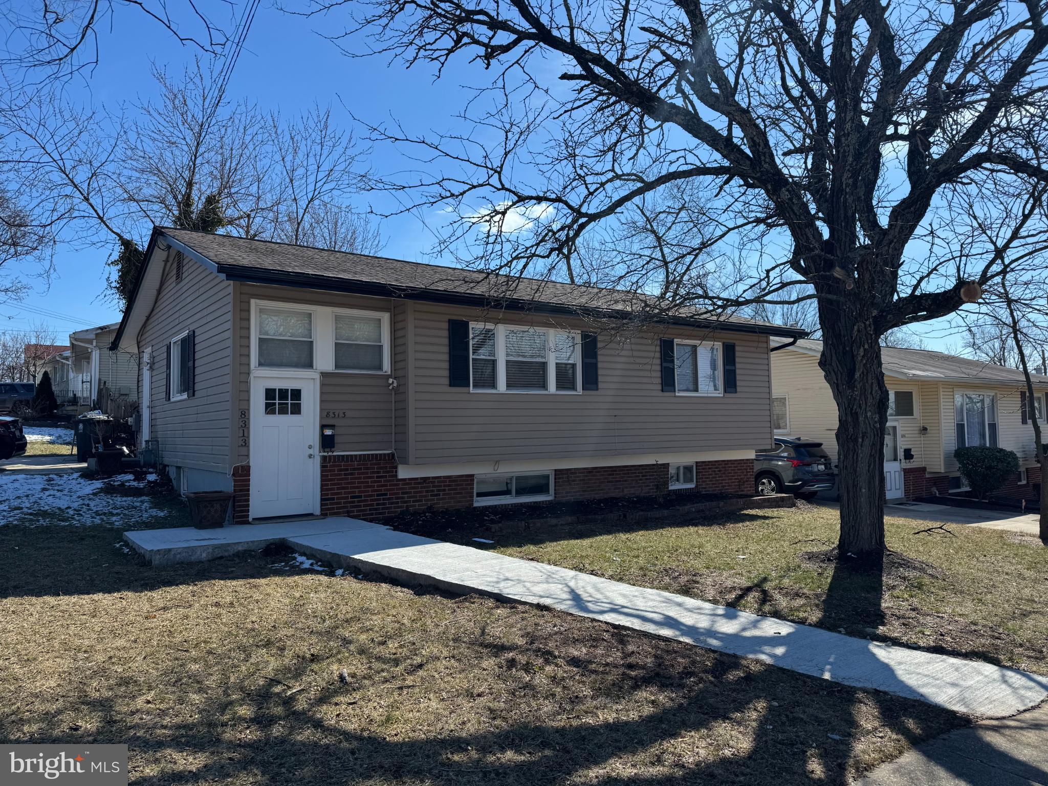 8313 26th Avenue Adelphi, MD 20783 - Photo 1 of 17 a front view of a house with garden