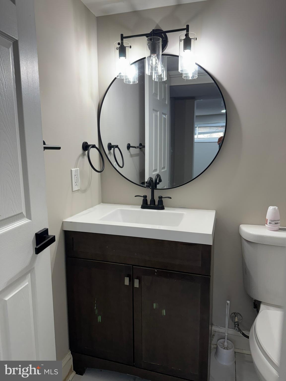 8313 26th Avenue Adelphi, MD 20783 - Photo 16 of 17 a bathroom with a sink and a mirror