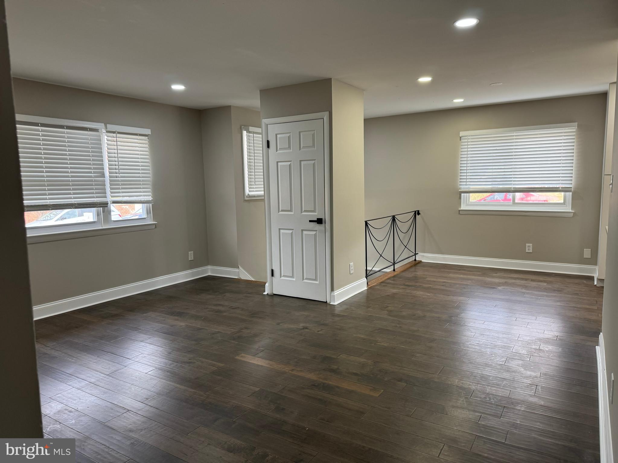8313 26th Avenue Adelphi, MD 20783 - Photo 3 of 17 an empty room with wooden floor and windows