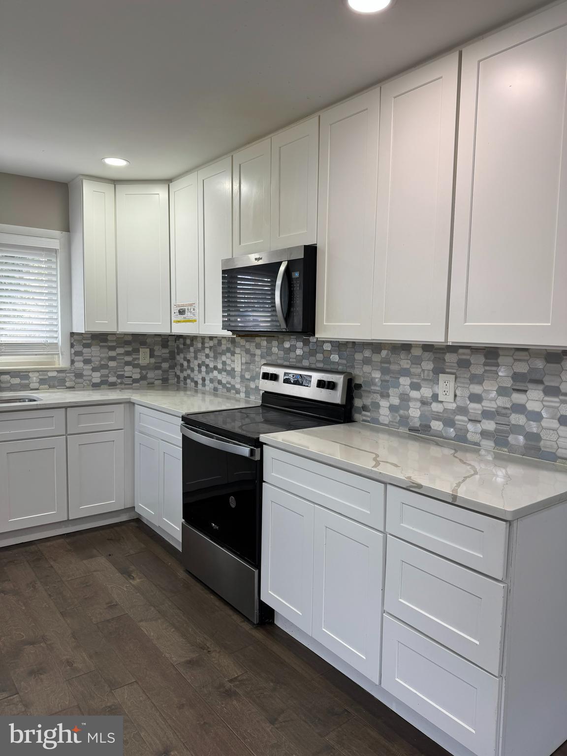 8313 26th Avenue Adelphi, MD 20783 - Photo 10 of 17 a kitchen with appliances a sink and cabinets