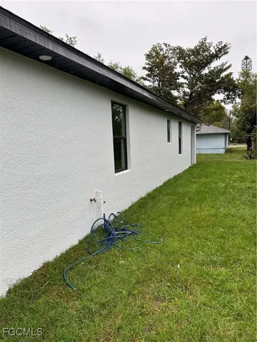 a backyard of a house with lots of green space