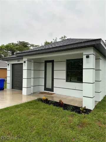 a small white building with a outdoor space
