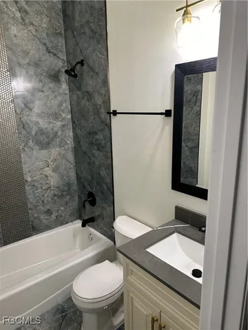 a bathroom with a sink a toilet and a bathtub