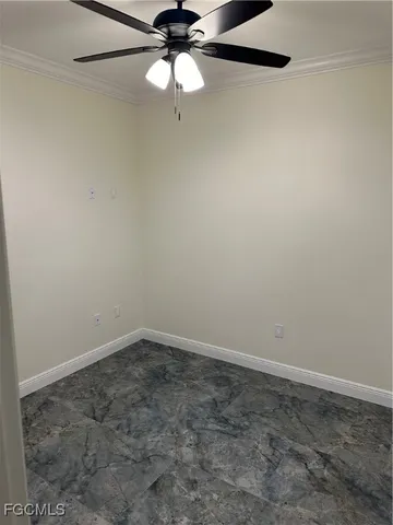 an empty room with a empty space and a ceiling fan