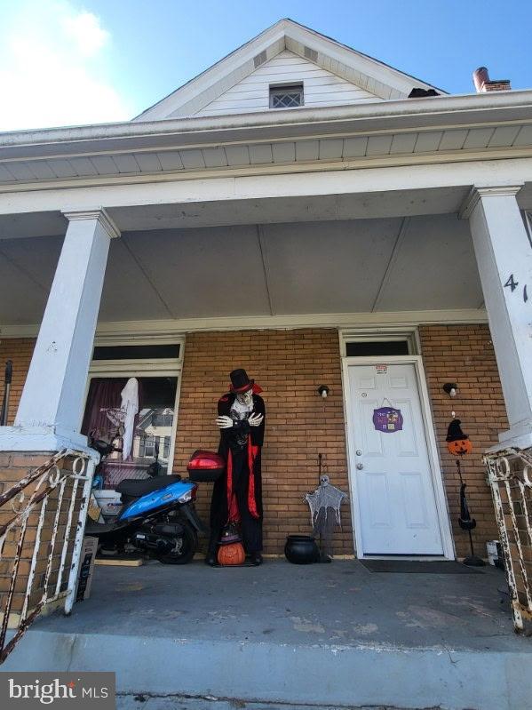 413 Delaware Street Monessen, PA 15062 - Photo 1 of 19 Spooky decor graces a charming porch.