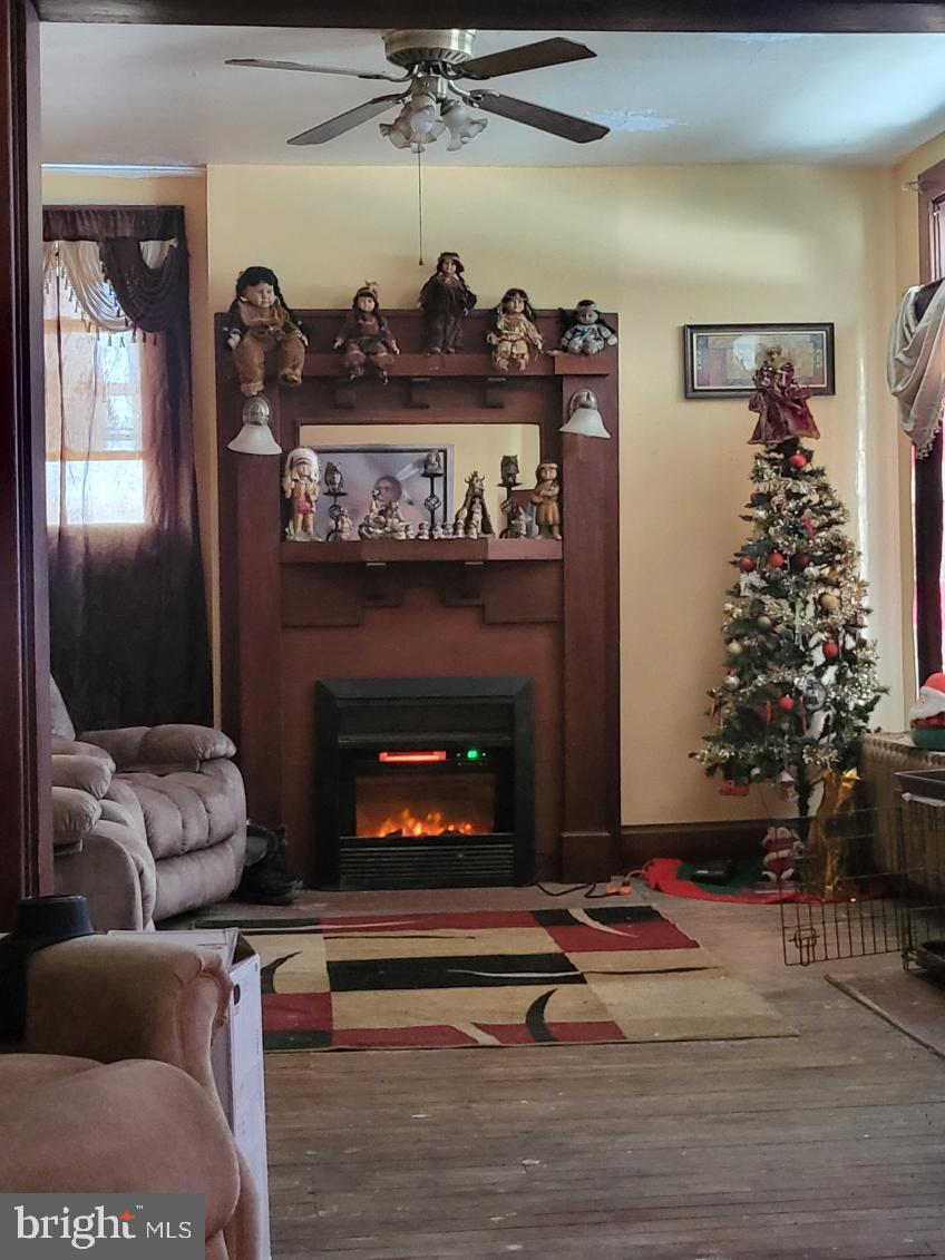 413 Delaware Street Monessen, PA 15062 - Photo 11 of 19 Charming living space with festive decor.