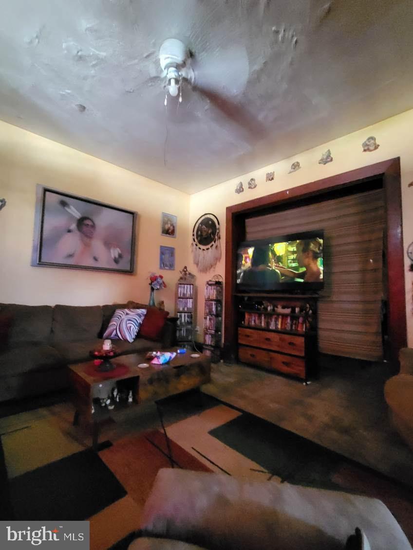 413 Delaware Street Monessen, PA 15062 - Photo 12 of 19 Cozy living space with vibrant decor.