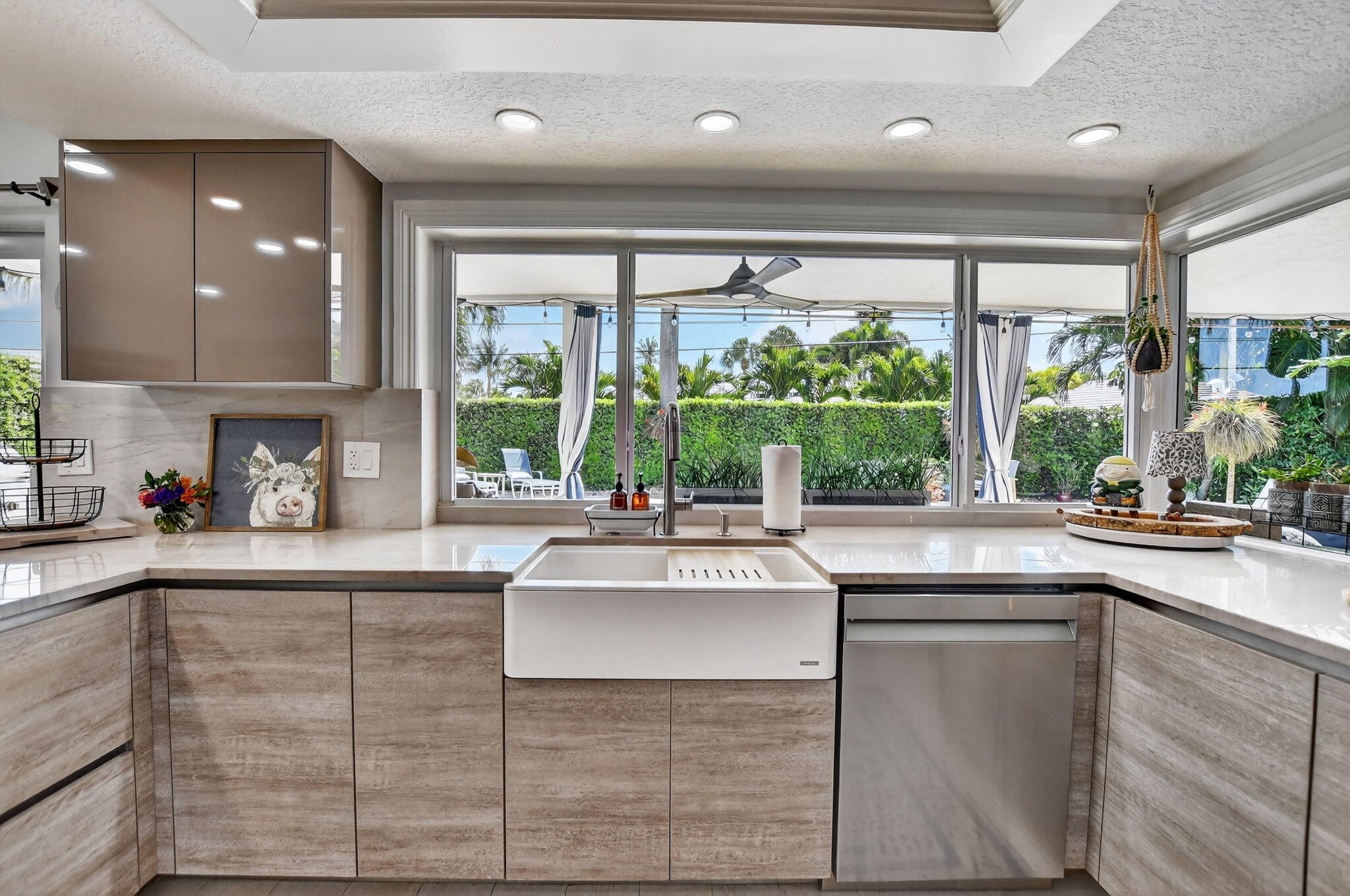 1388 Walnut Terrace Boca Raton, FL 33486 - Photo 17 of 74 a kitchen with kitchen island granite countertop a sink and white cabinets