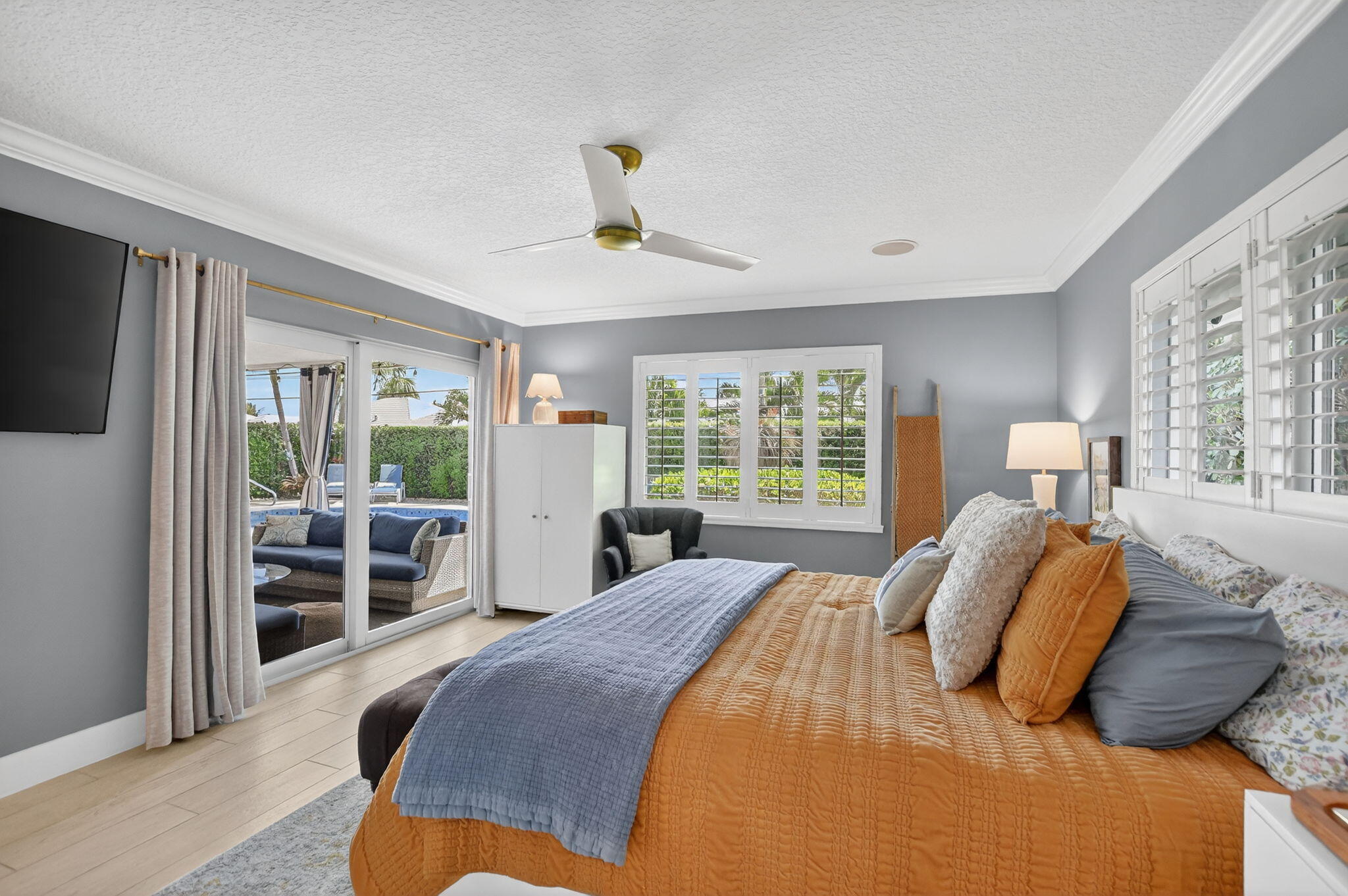 1388 Walnut Terrace Boca Raton, FL 33486 - Photo 30 of 74 a bedroom with a large bed and a flat tv screen