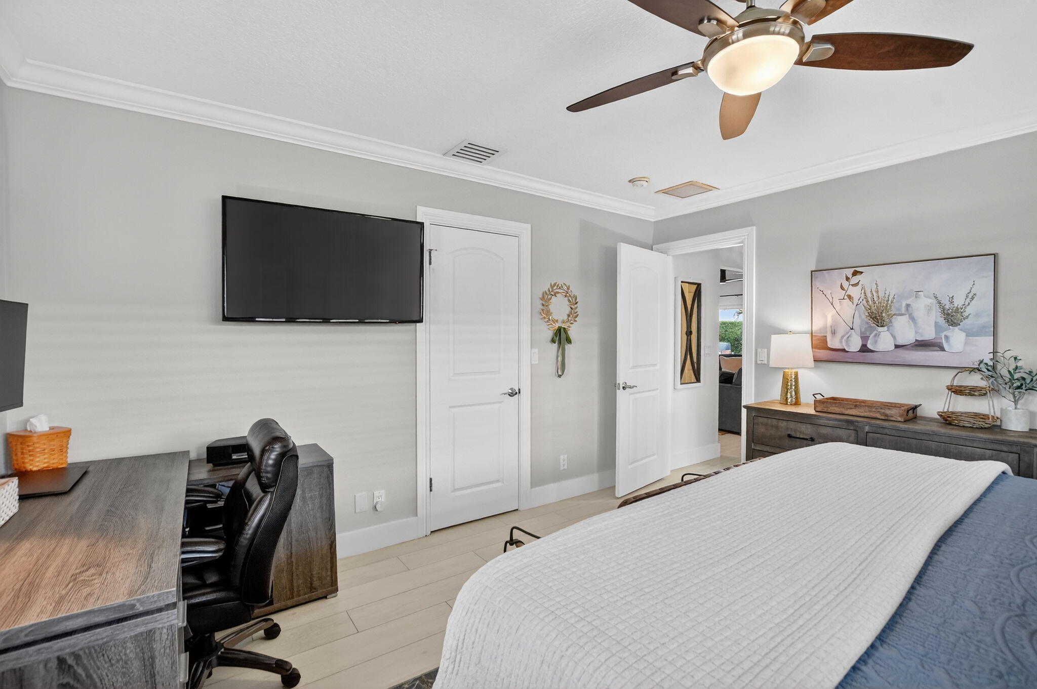 1388 Walnut Terrace Boca Raton, FL 33486 - Photo 37 of 74 a bedroom with a bed and a flat screen tv