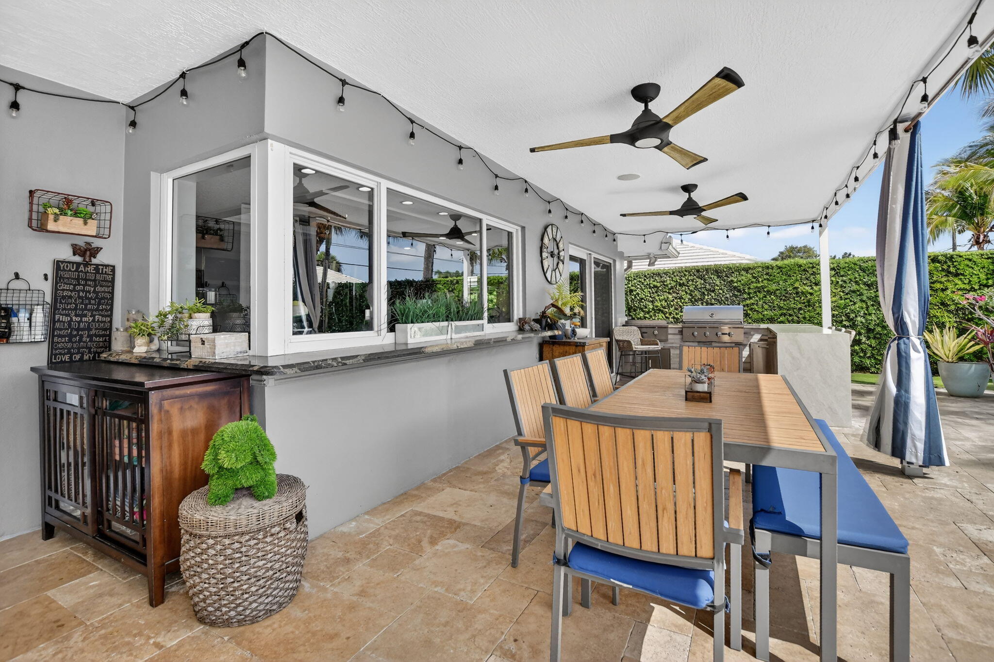 1388 Walnut Terrace Boca Raton, FL 33486 - Photo 43 of 74 a dining room with furniture mountain view and a floor to ceiling window