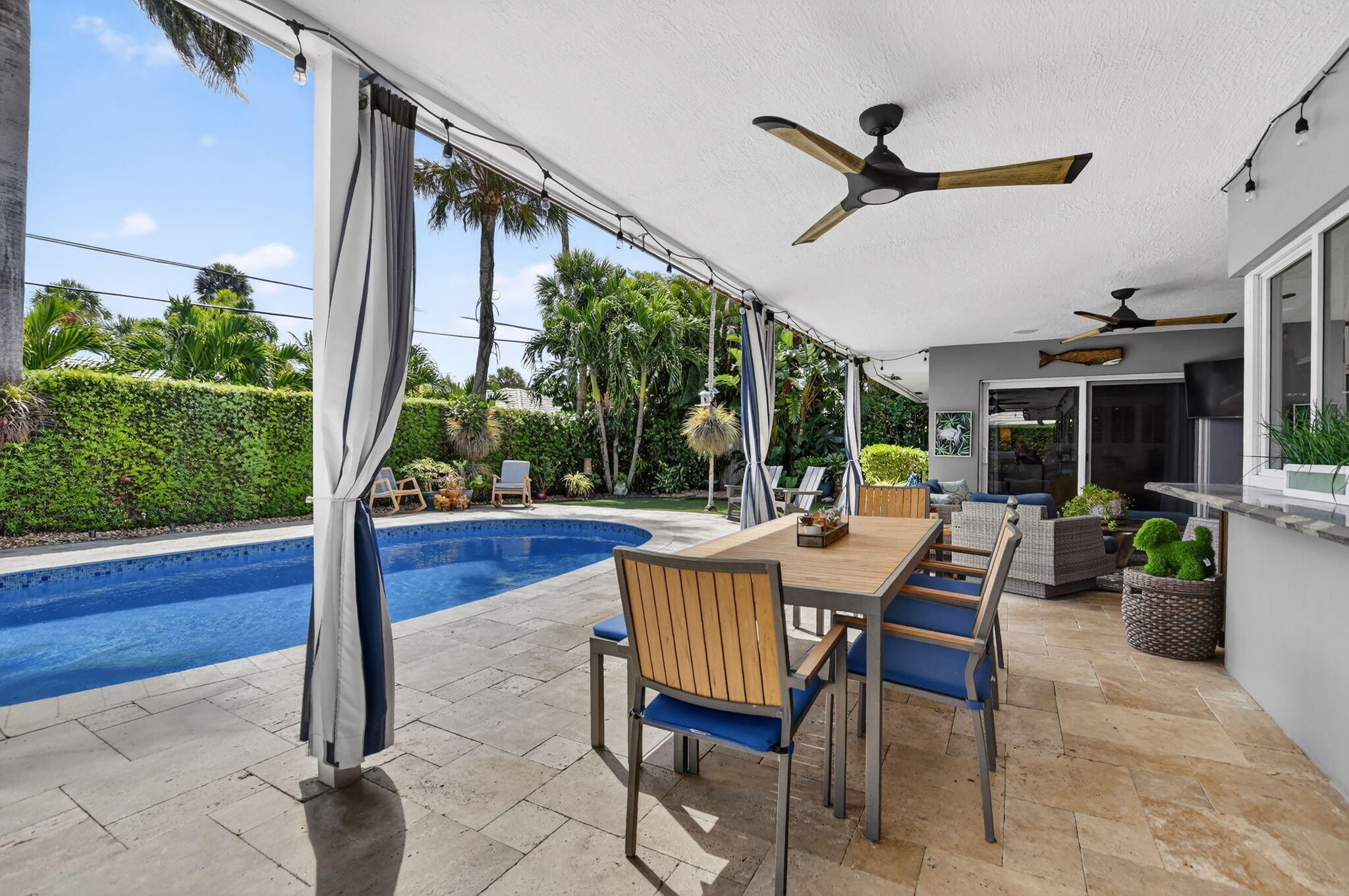 1388 Walnut Terrace Boca Raton, FL 33486 - Photo 44 of 74 a view of a patio with a dining table and chairs