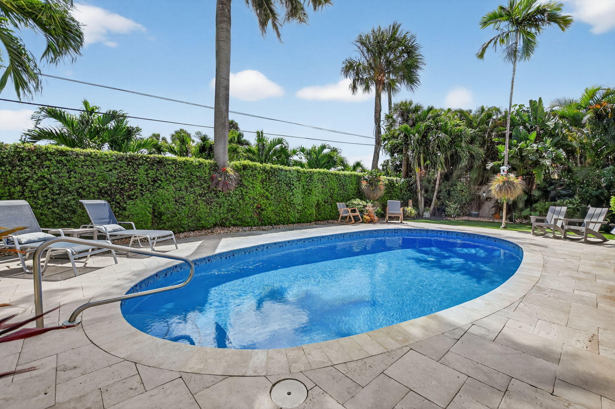 1388 Walnut Terrace Boca Raton, FL 33486 - Photo 48 of 74 a view of a swimming pool with a patio
