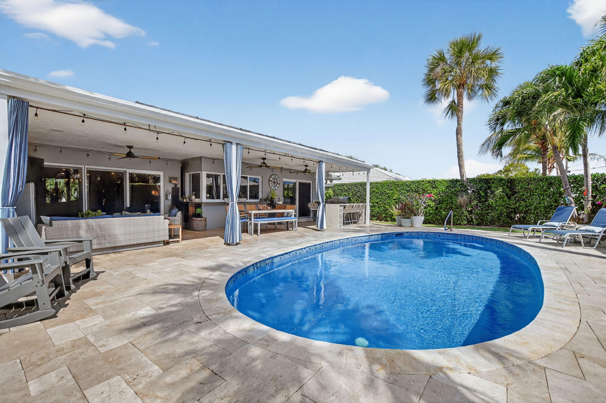 1388 Walnut Terrace Boca Raton, FL 33486 - Photo 50 of 74 a view of a swimming pool with outdoor seating and plants