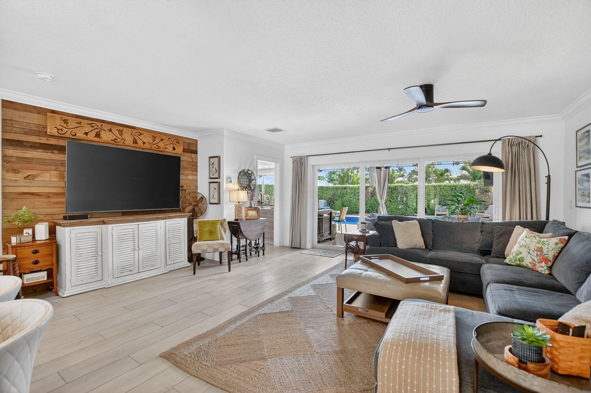 1388 Walnut Terrace Boca Raton, FL 33486 - Photo 9 of 74 a living room with furniture and a flat screen tv