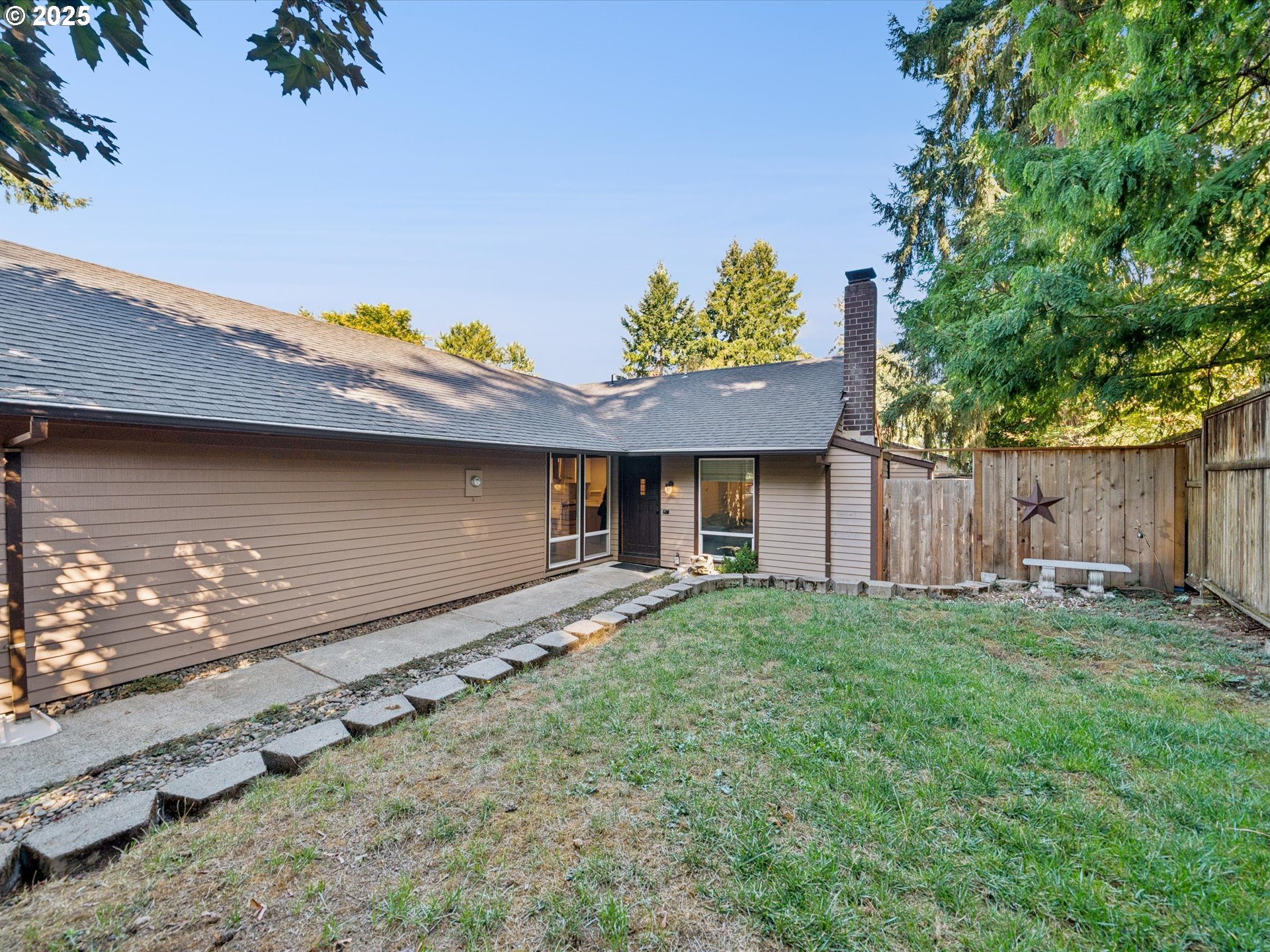 5100 Southwest 153rd Avenue Beaverton, OR 97007 - Photo 1 of 39 a front view of a house with a yard