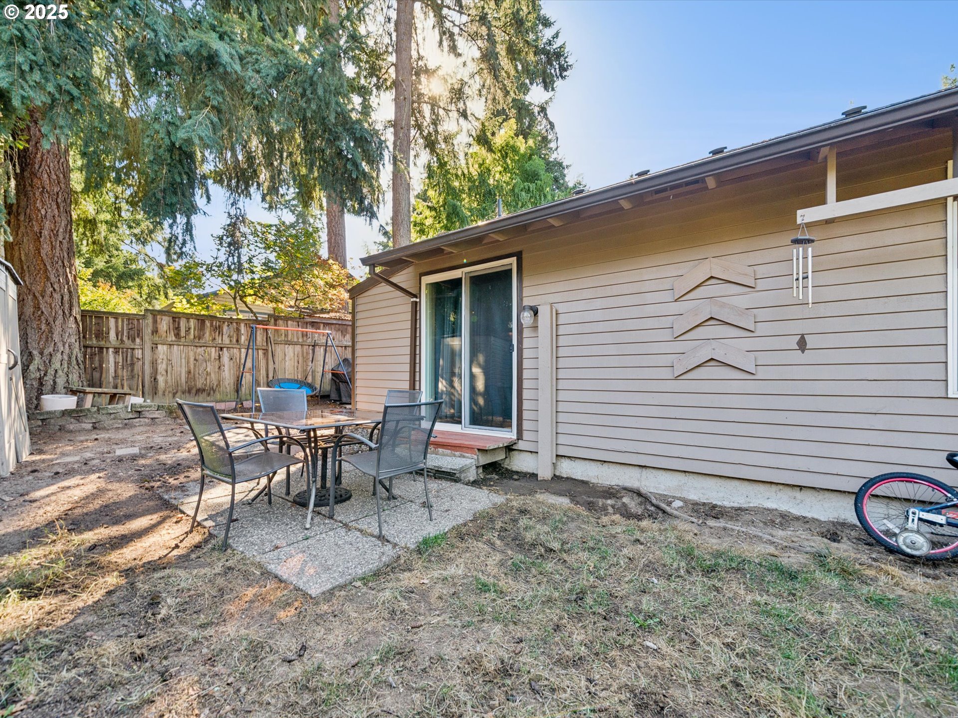 5100 Southwest 153rd Avenue Beaverton, OR 97007 - Photo 12 of 39 a view of a chairs and table in backyard of the house