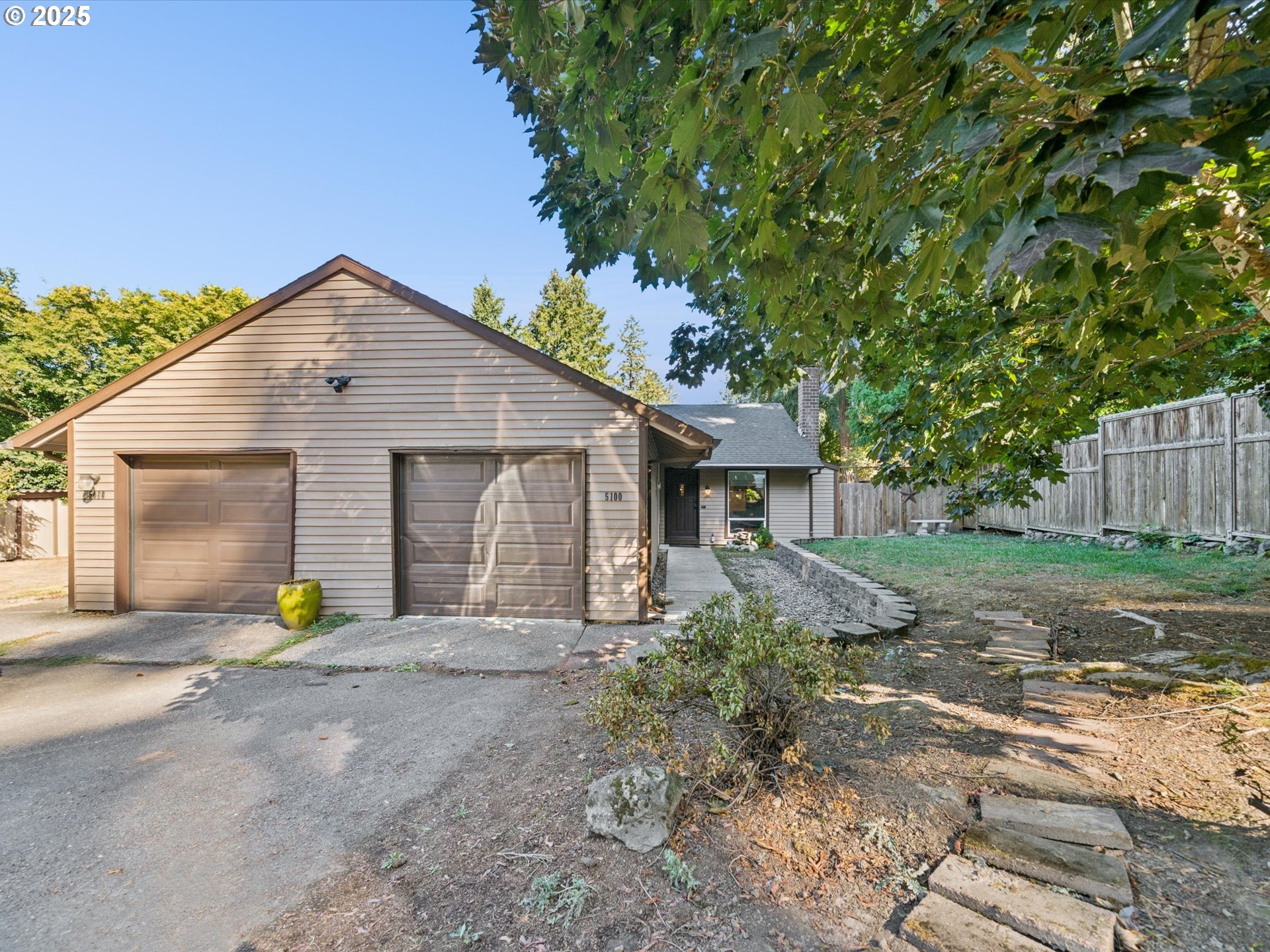 5100 Southwest 153rd Avenue Beaverton, OR 97007 - Photo 14 of 39 a view of a house with backyard and a tree