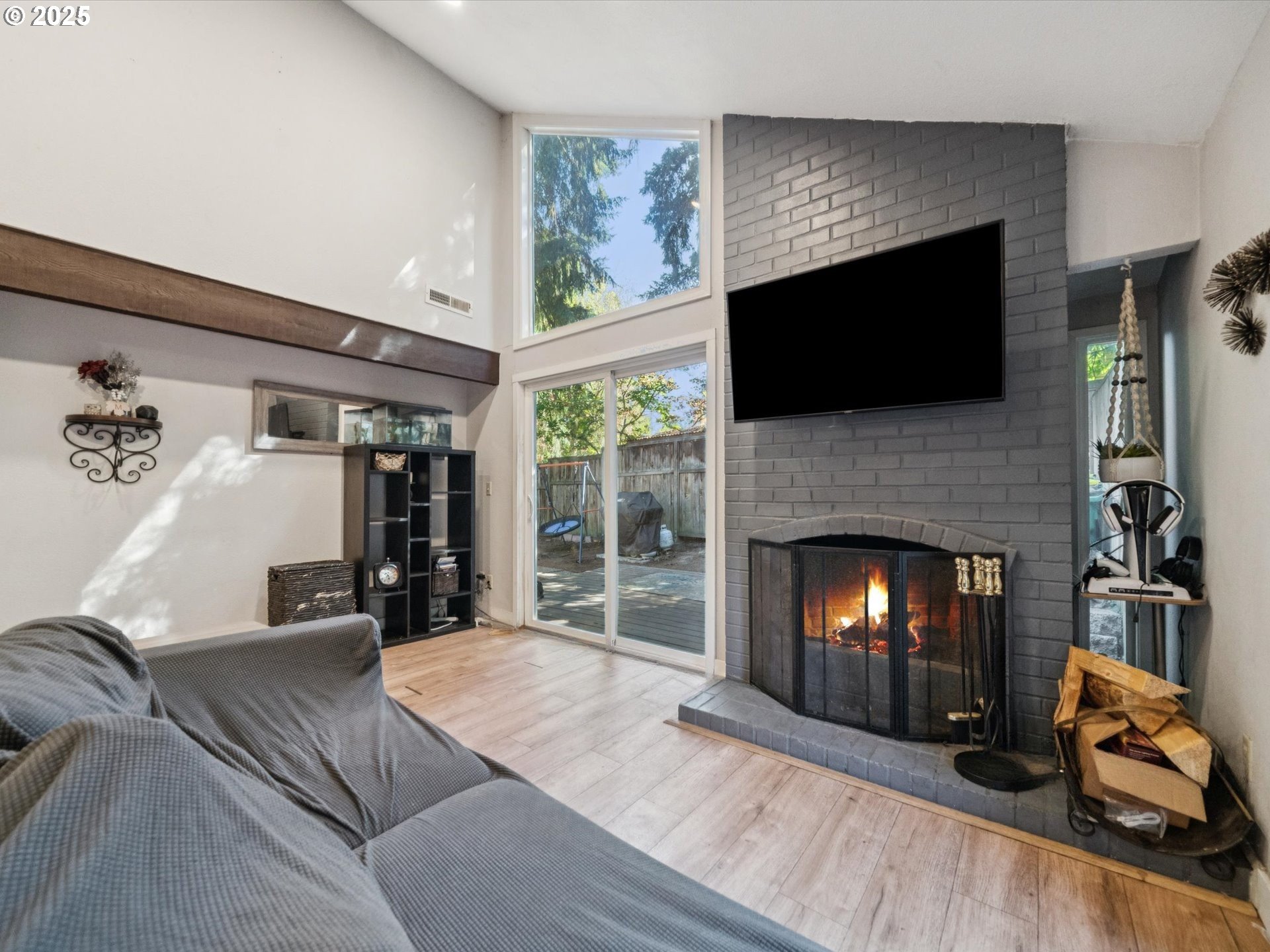 5100 Southwest 153rd Avenue Beaverton, OR 97007 - Photo 17 of 39 a living room with furniture and a fireplace
