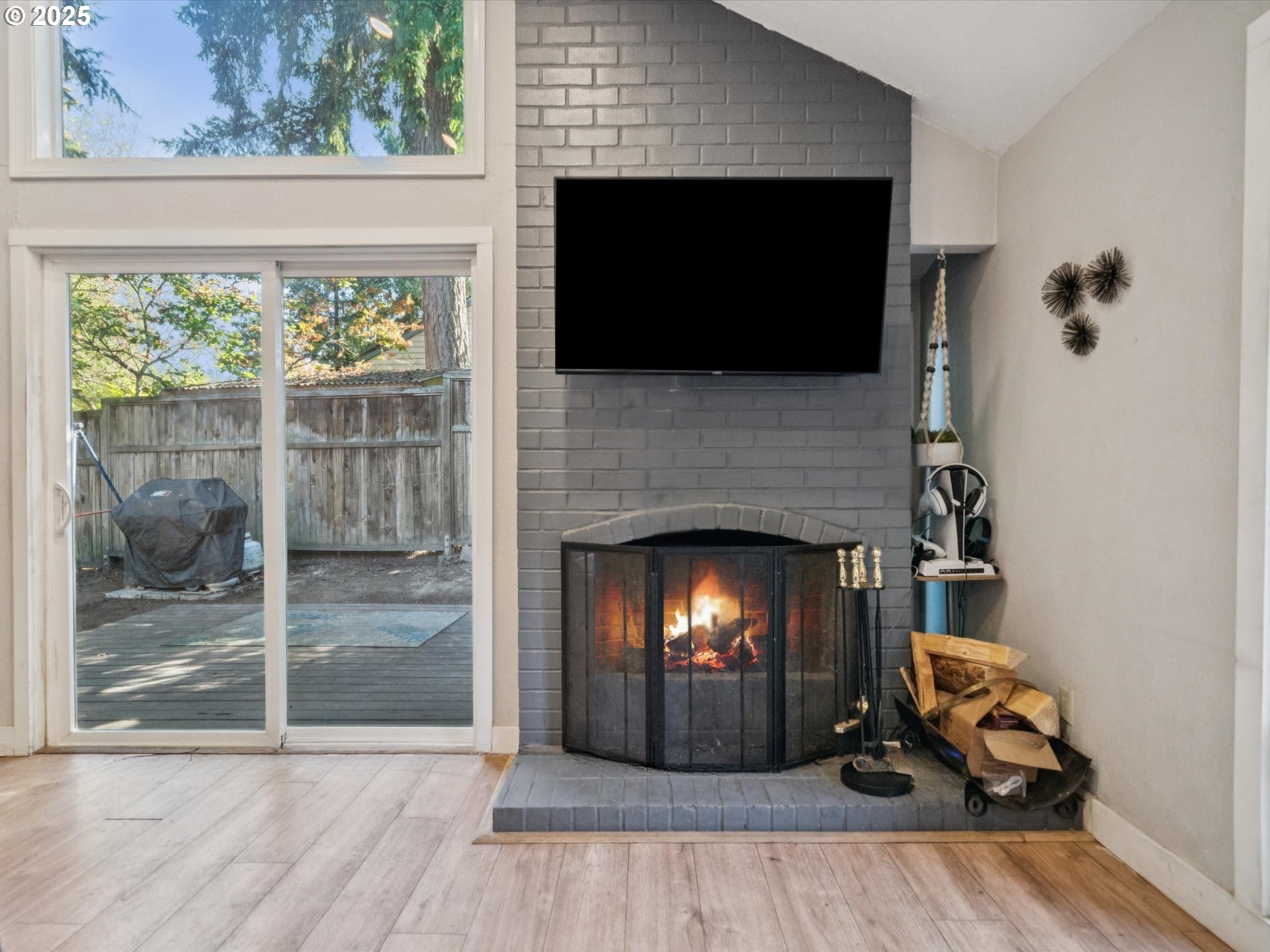 5100 Southwest 153rd Avenue Beaverton, OR 97007 - Photo 2 of 39 a living room with a fireplace and a flat screen tv