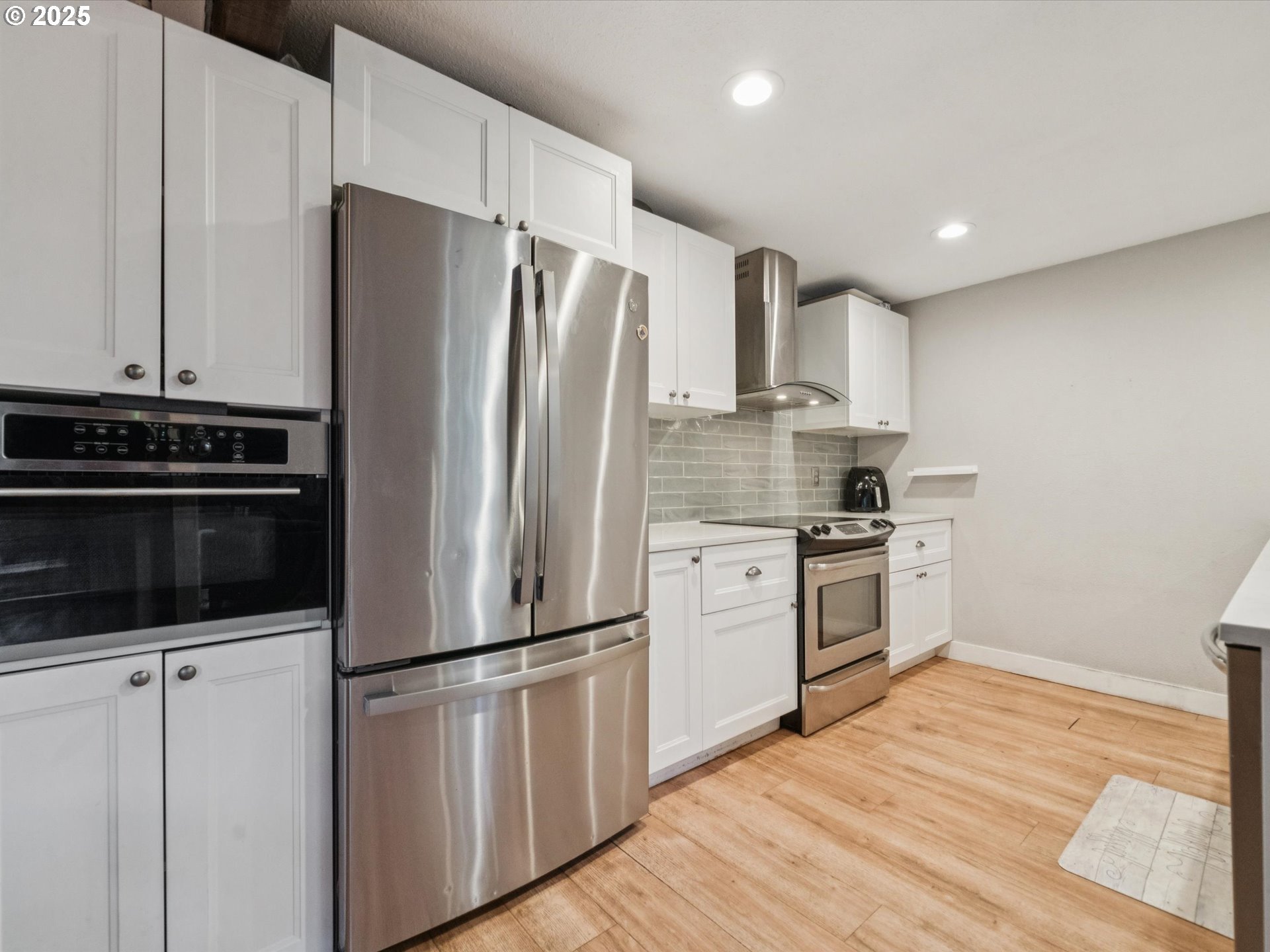 5100 Southwest 153rd Avenue Beaverton, OR 97007 - Photo 22 of 39 a kitchen with stainless steel appliances a refrigerator stove and sink