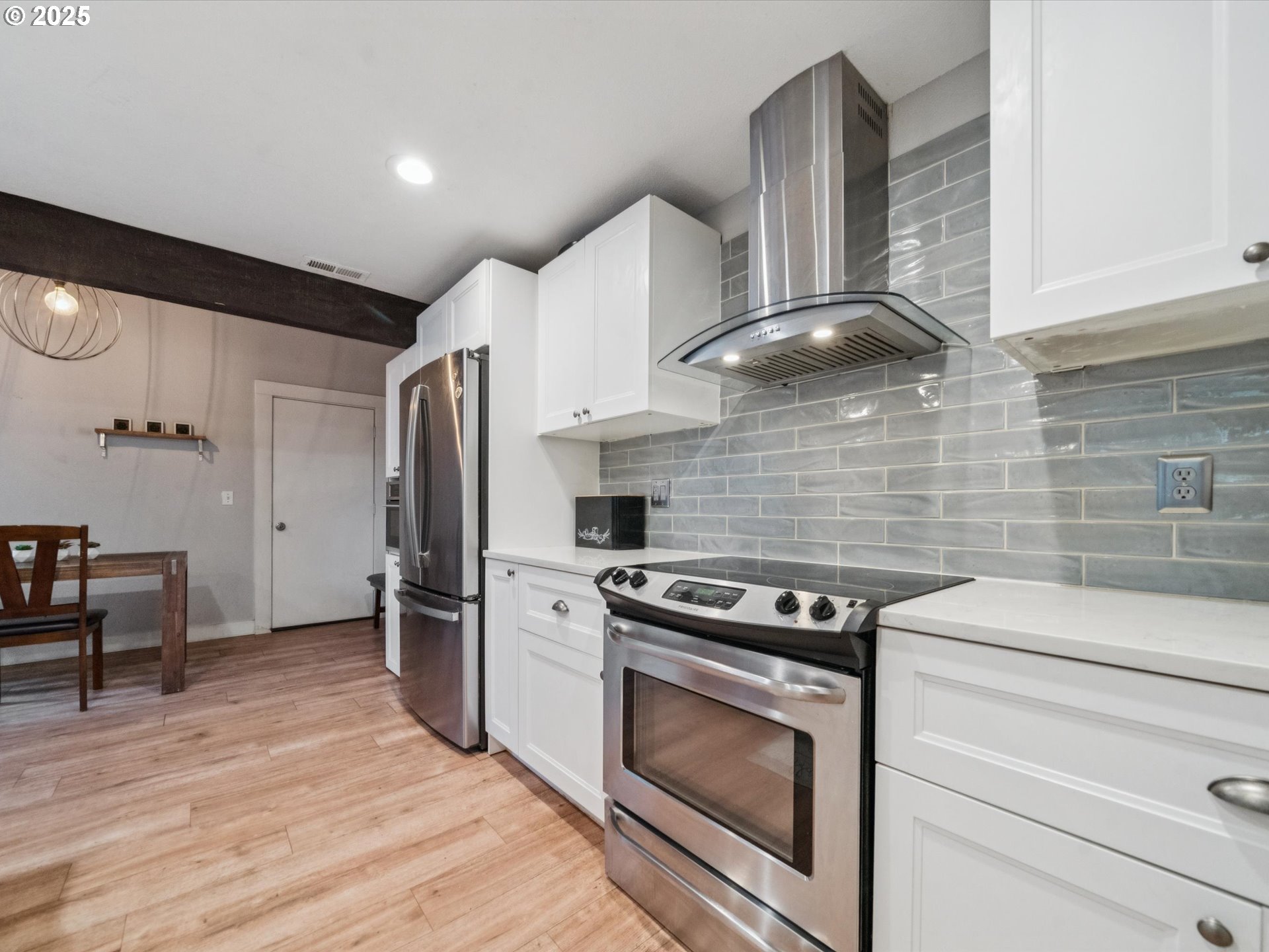 5100 Southwest 153rd Avenue Beaverton, OR 97007 - Photo 3 of 39 a kitchen with a stove and a refrigerator