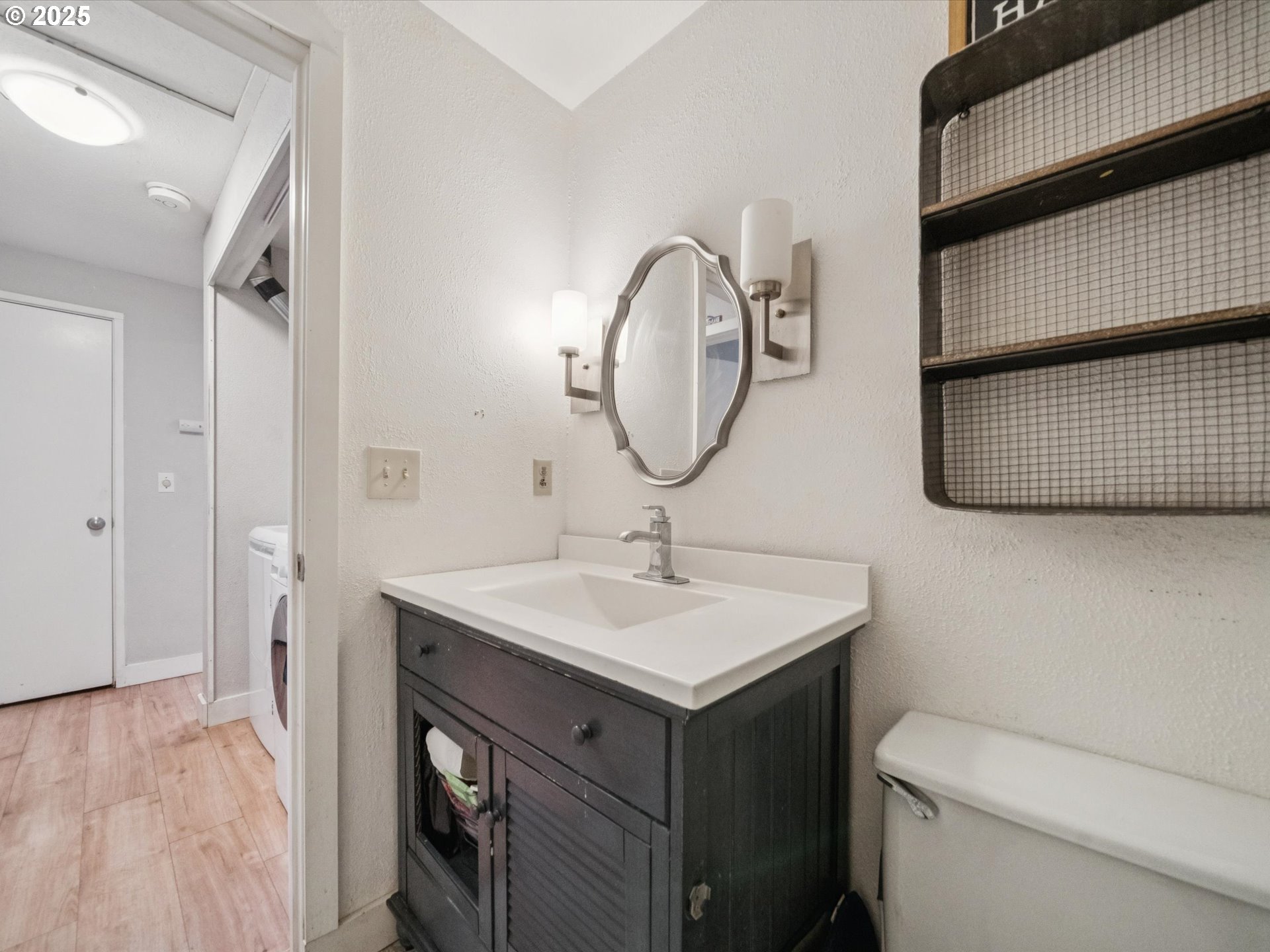 5100 Southwest 153rd Avenue Beaverton, OR 97007 - Photo 33 of 39 a bathroom with a sink and a mirror