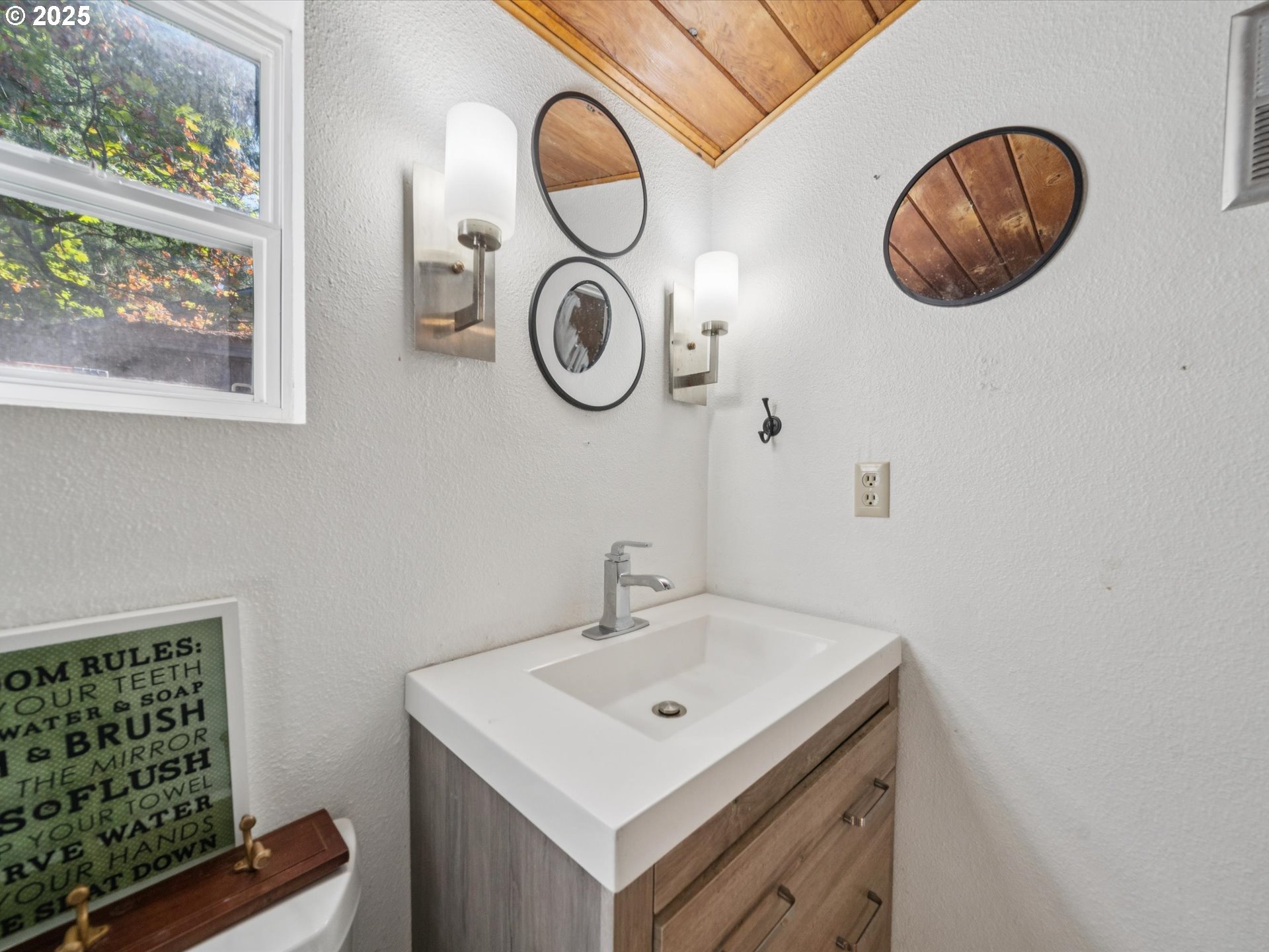 5100 Southwest 153rd Avenue Beaverton, OR 97007 - Photo 7 of 39 a bathroom with a sink and a mirror