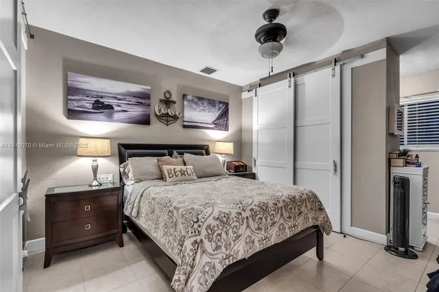 a view of a backyard with table and chairs and a tree