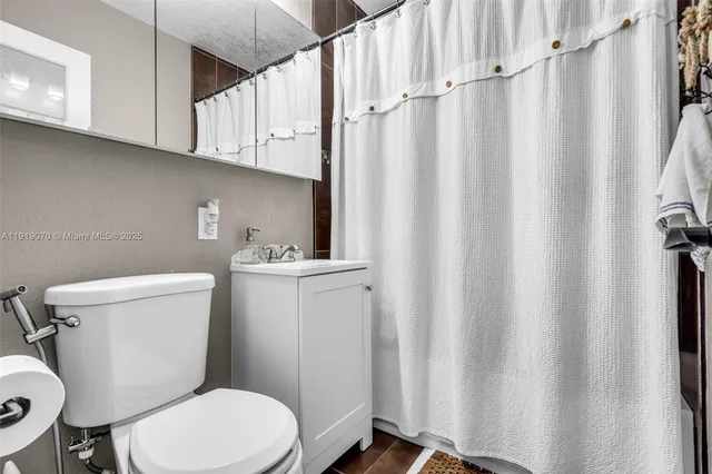 a view of a chair and table in backyard