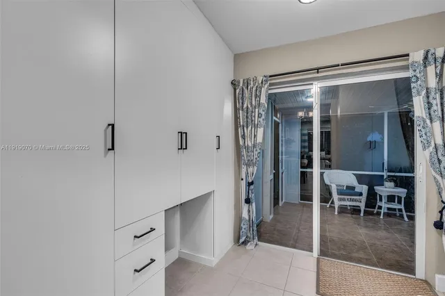 a view of a patio with a table chairs and a backyard