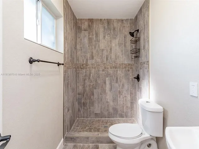 a bedroom with a bed and a walk in closet