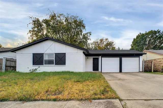 a house with trees in the background