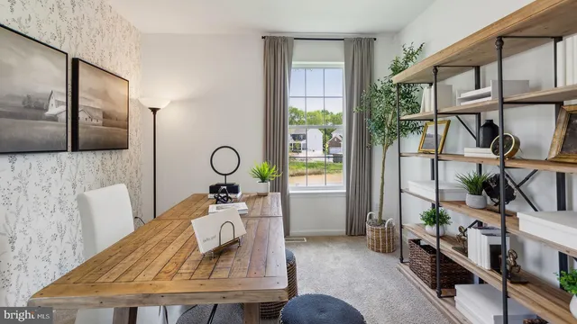 a view of living room filled with furniture and windows