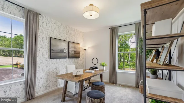 a view of a livingroom with furniture and window