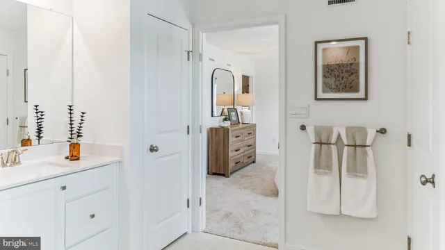 a bathroom with a double vanity sink and mirror