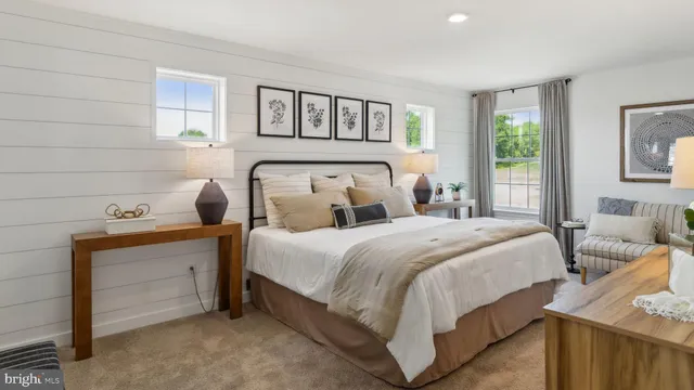 a bedroom with bed and window