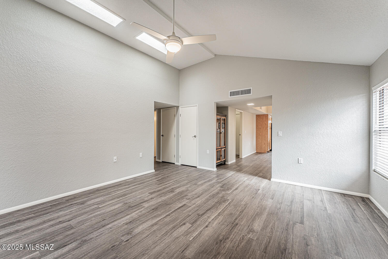 931 West Rio Guaymas Green Valley, AZ 85614 - Photo 19 of 39 wooden floor in an empty room with a window
