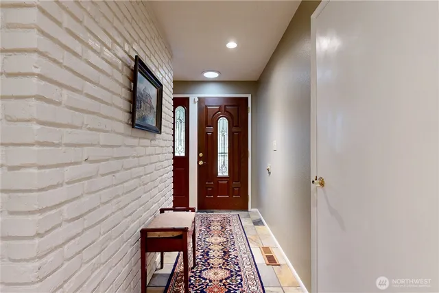 a view of hallway with wooden floor