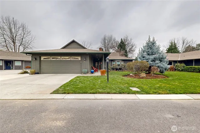 a view of a porch with furniture and garden