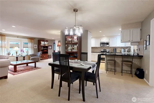 a dining room with furniture and window