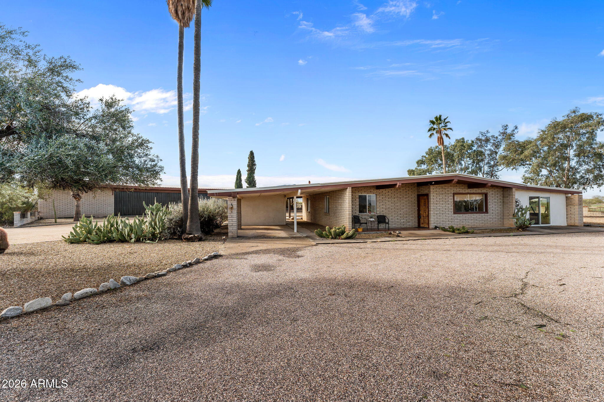 50907 West Iver Road Aguila, AZ 85320 - Photo 25 of 46 a front view of a house with a yard and garage
