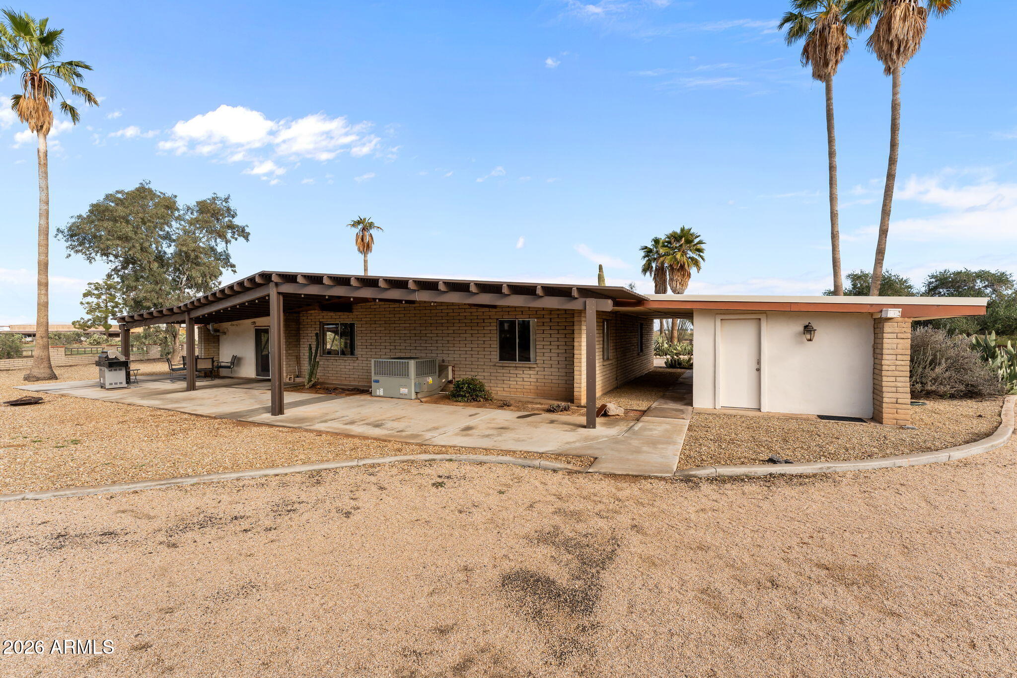 50907 West Iver Road Aguila, AZ 85320 - Photo 35 of 46 a view of a grey house with a yard
