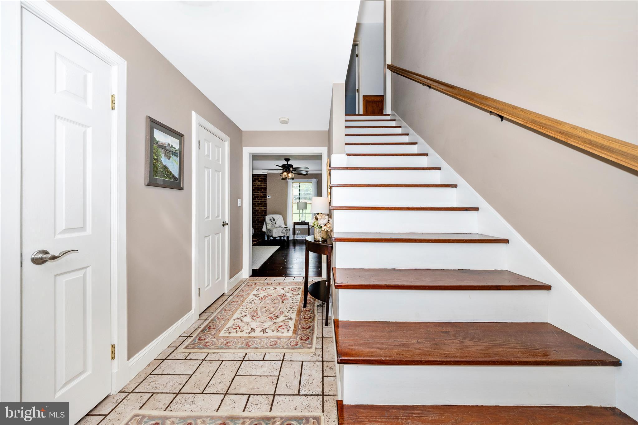15810 Spade Road Hagerstown, MD 21740 - Photo 3 of 76 a view of staircase with wooden floor and lots of frames on wall
