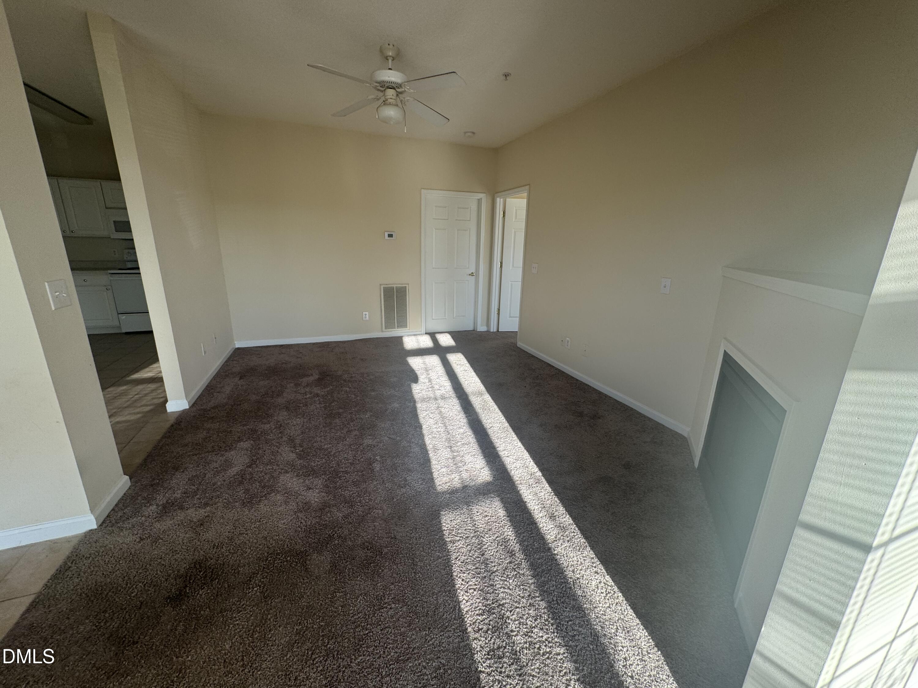 2510 Friedland Place, Unit 202 Raleigh, NC 27617 - Photo 11 of 25 a view of an empty room and wooden floor