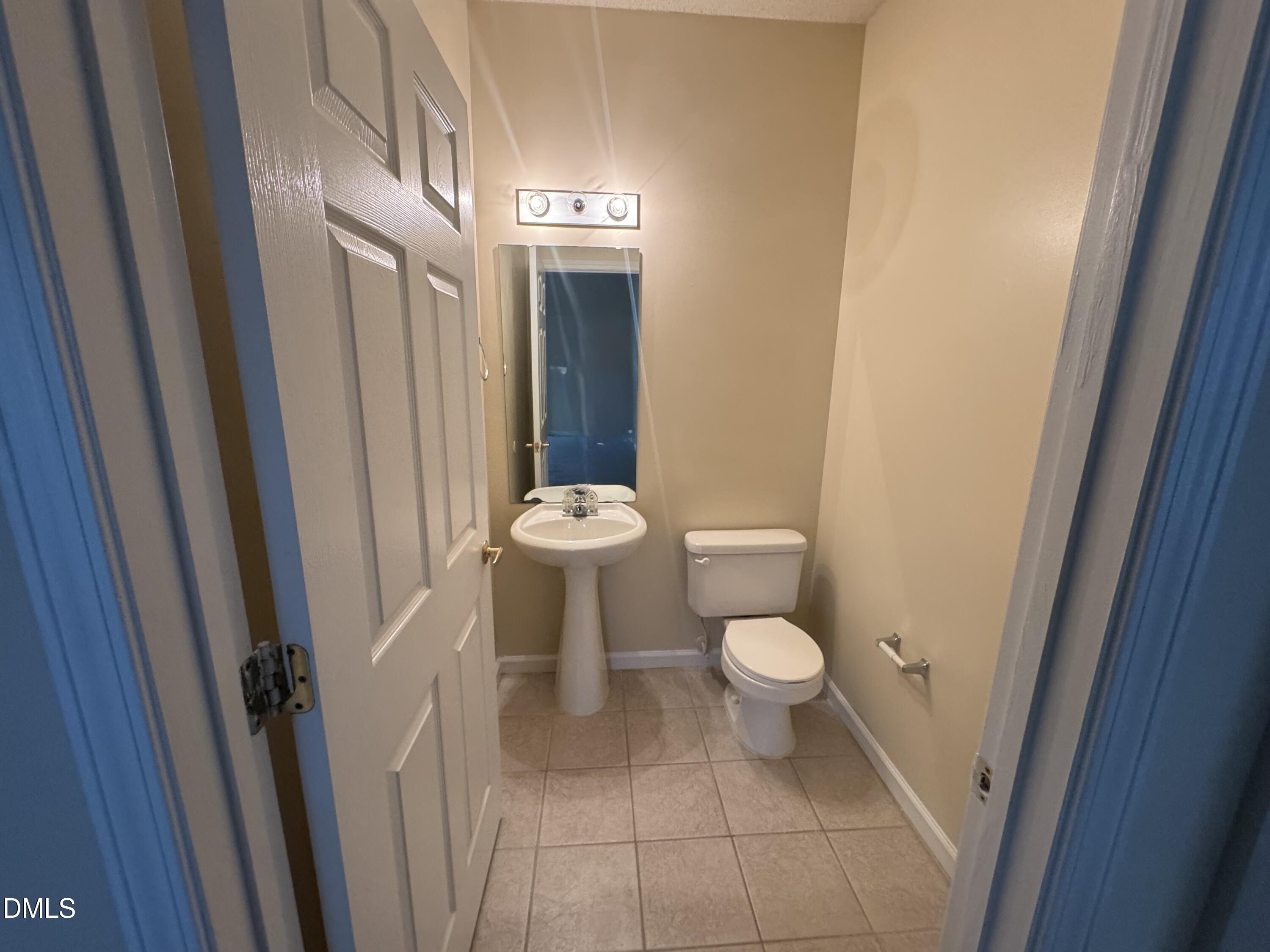 2510 Friedland Place, Unit 202 Raleigh, NC 27617 - Photo 18 of 25 a white toilet sitting next to a sink